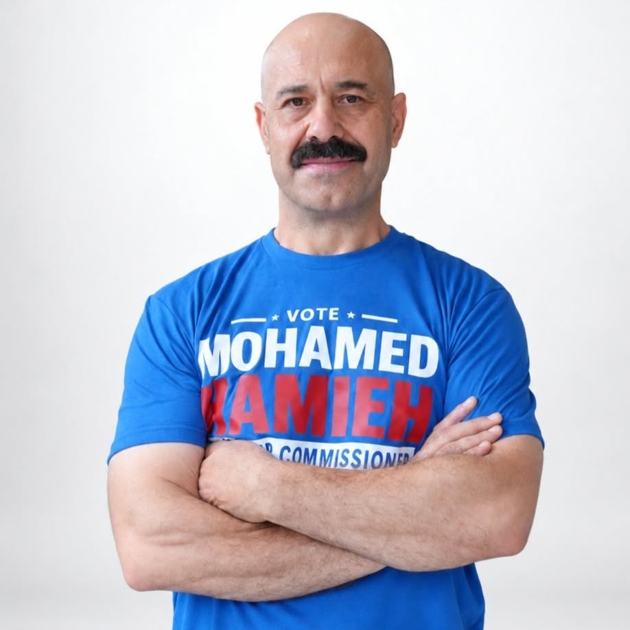 Mohamed Hamieh wearing a blue campaign shirt